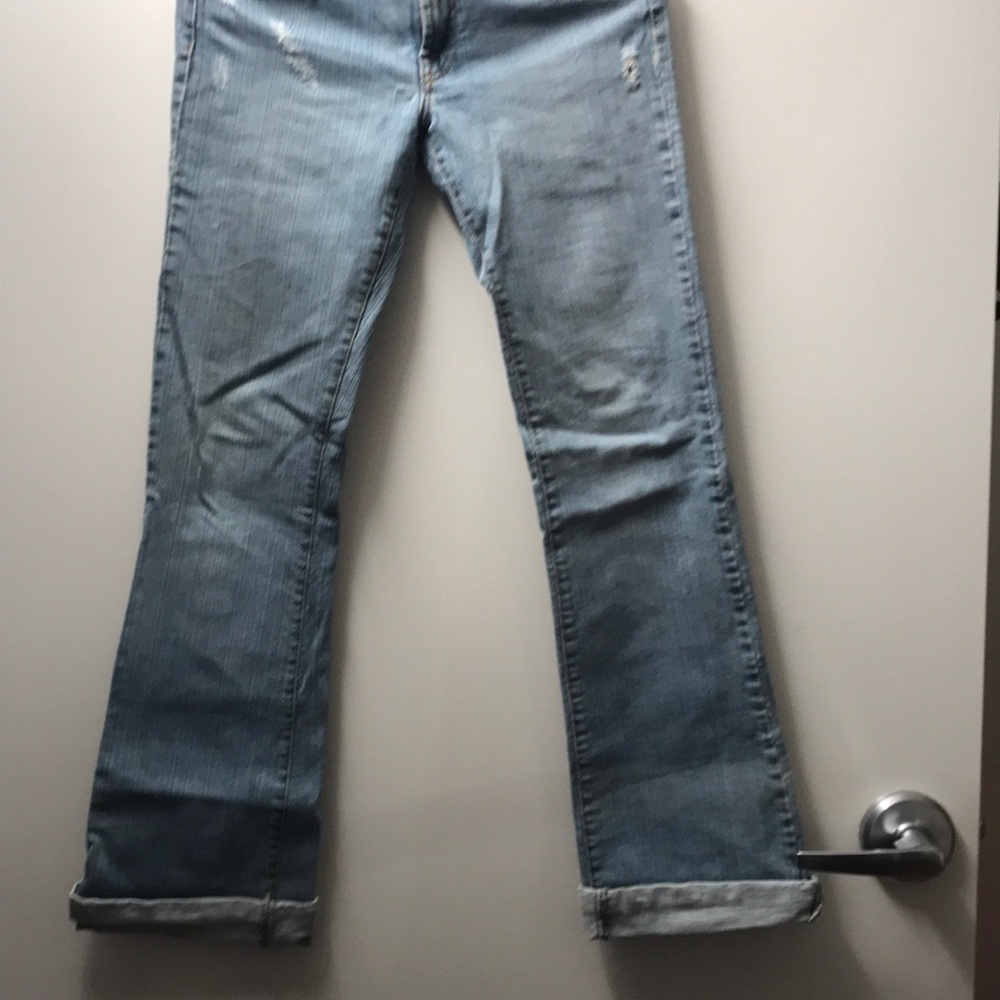 Boot cut distressed jeans